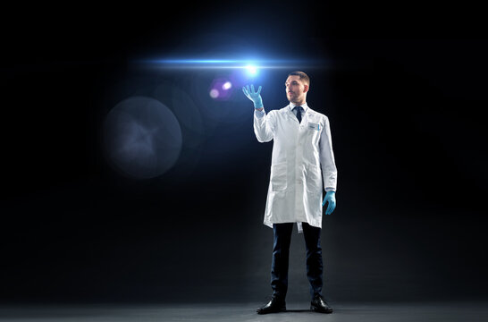 Doctor Or Scientist In Lab Coat With Laser Light