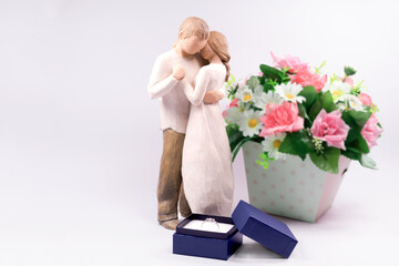 Love concept of couple  doll and diamond  wedding  ring  in box