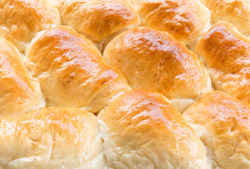 Several pieces of bread placed on the tray. Freshly baked bread had just finished.