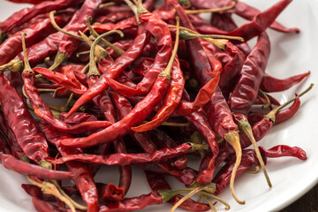 Red Dried Chillies or Dry chillies on white plate

