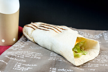 Mexican fajita wraps with grilled chicken fillet and fresh vegetables