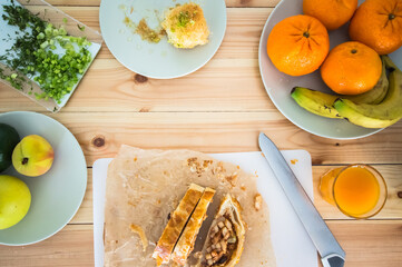 Light breakfast with oriental sweets. Wooden background. Top view. Close-up