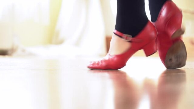 Closeup of red shoes dancing in the studio