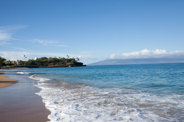 Waves crashing on the beach in maui
