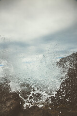 Waves crashing or rocks in hawaii