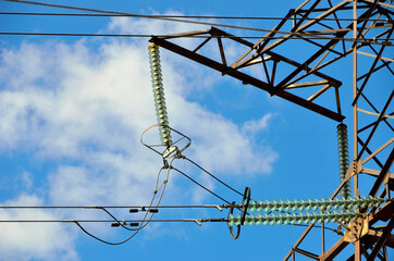 High voltage. Transmission line Insulators. Blue sky background.