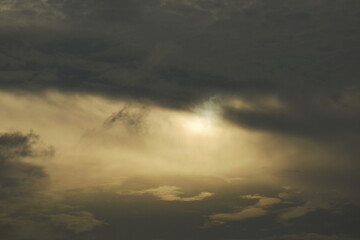 sun behind dark cloud look a like eye on sky