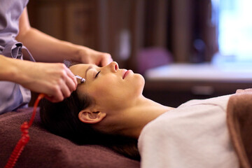 woman having hydradermie facial treatment in spa