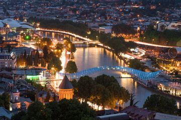 Aerial view of night Tbilisi with river Kura © ilyaska