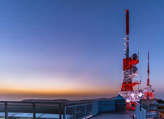 Fototapeta na wymiar Radio towers with twilight sky at Mount Inasa Observation Platform (Nagasaki, Japan)