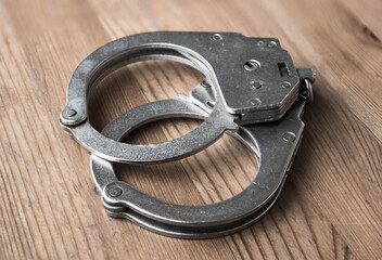 Obraz premium handcuffs. Close-up photo, closed bracelets. Police and crime symbol