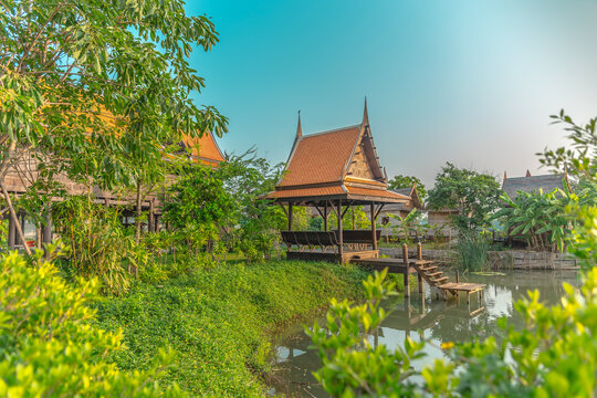 Thai hut on a l pond surrounded with greenery 