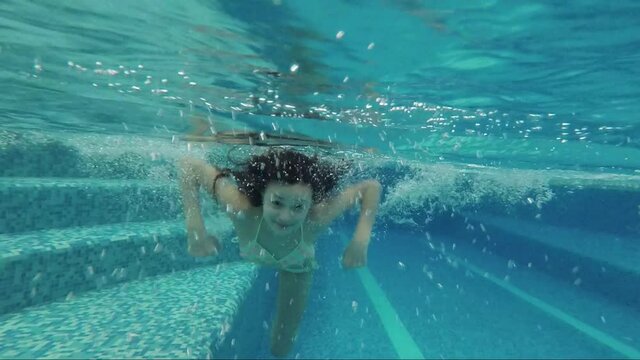 Underwater shooting of a teenager in the pool
