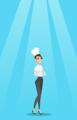 Confident female chief cook with arms crossed.