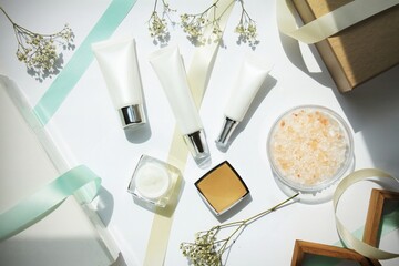 Cosmetic bottle containers with ribbon and gift boxes, Blank label for branding mock-up, Gift set bottles for sale promotion festival.