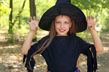 Beautiful girl witch in the park, outdoor