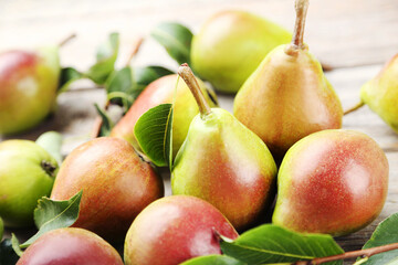 Ripe pears on grey wooden table