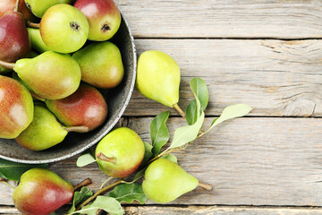 Ripe pears on grey wooden table
