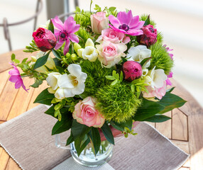 Large beautiful bouquet of peonies, roses, anemones in a vase