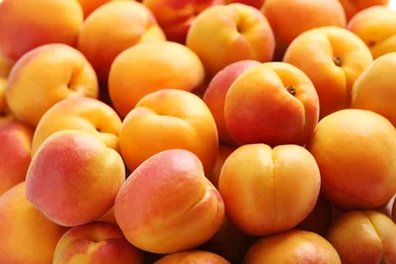 Muurstickers Ripe apricots fruit background © 5second