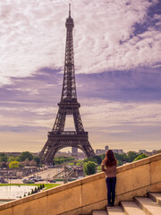 A girl is looking at Eiffel tower,Paris