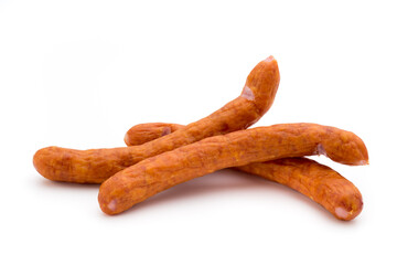 Stack of smoked sausages isolated on a white background.