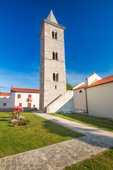 Fototapeta na wymiar Tower bell of church of Saint Anselmo in Nin, Dalmatia, Croatia