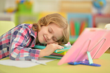  girl sleeping on table