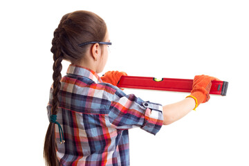 Little girl holding building level 