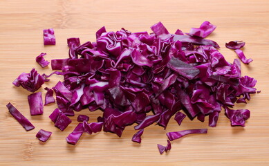 Sliced red cabbage on wooden table