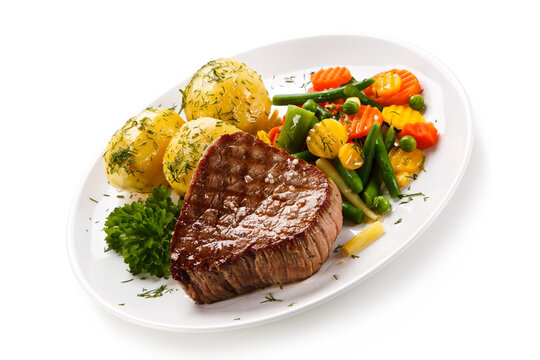 Grilled beefsteak with potatoes on white background