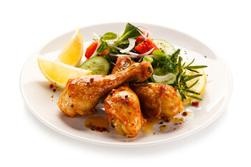 Roast drumsticks on white background