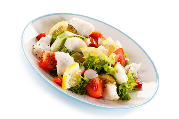 Salad with grilled fish fillet on white background