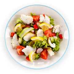 Salad with grilled fish fillet on white background
