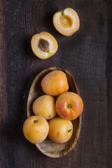 Fresh apricots on wooden table