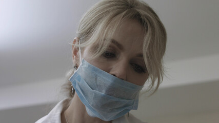 Cosmetologist during the procedure of lip augmentation