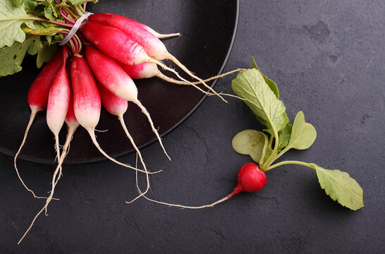 A bunch of ripe radish on an black background