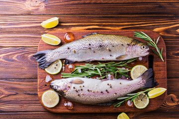 Seafood. Two raw rainbow trouts marinated with lime, rosemary