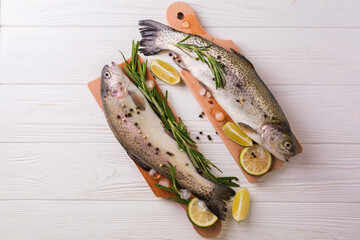 Seafood. Two raw rainbow trouts marinated with lime, rosemary