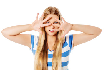 Woman covering her face with hands.