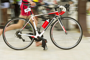Obraz premium triathlon competitors in ciclyng , cyclist in action and motion