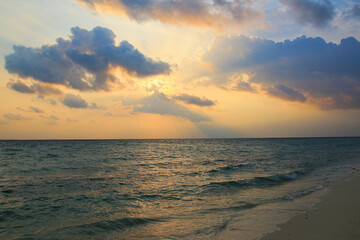 Sunset over beach of Ukulhas in the Indian ocean, Maldives