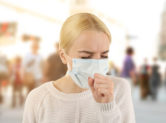 Woman wearing mask isolated on white