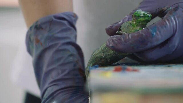 Squeezing paint out of a tube