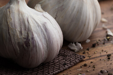 Fresh garlic, pepper and spices, rustic style, selective focus
