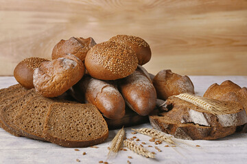 Delicious rye bread on wooden background