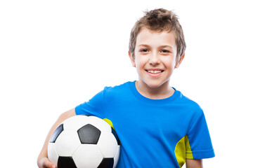 Handsome smiling child boy holding soccer ball