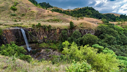 Fototapeta premium Waterfall near Monks Cowl in the Drakensberg Mountains in KwaZulu-Natal