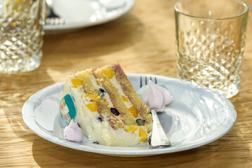 Piece of birthday cake served on a little plate