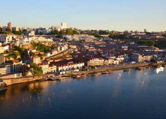 Reflection of the sun at river Douro and city during Sunset, seen from Ponte Luis at Sunset - Porto, Portugal